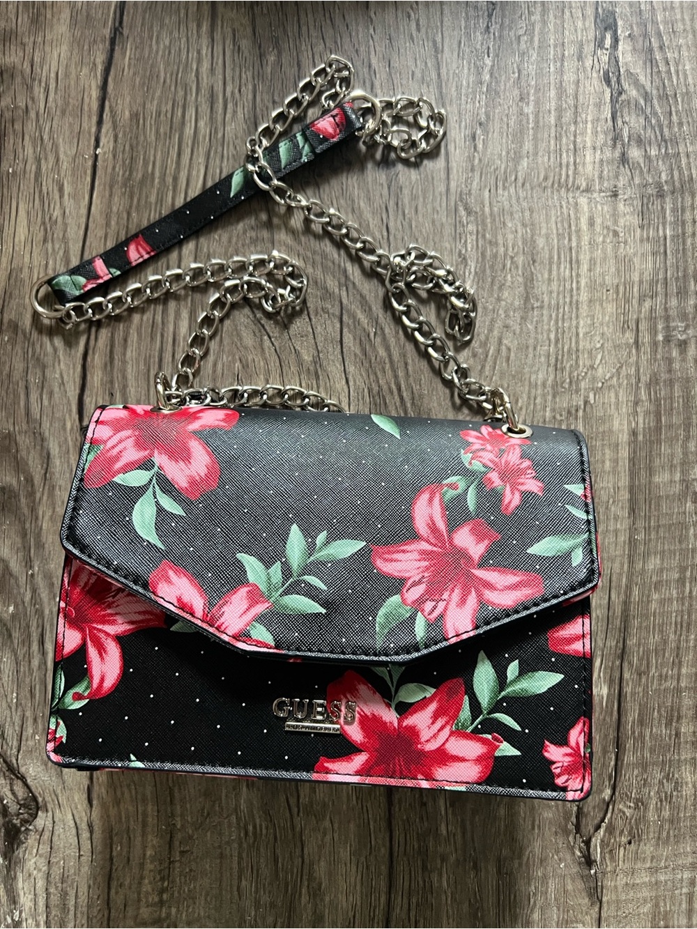 GUESS Black Floral Chain Strap Crossbody with Pink lilies.